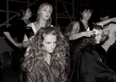 Nicci Welsh working backstage at fashion show with model